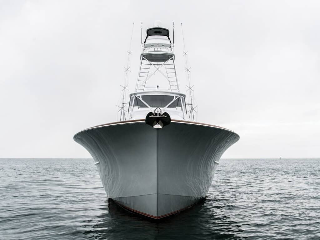 A front view of a Scarborough Boatworks sport-fishing boat anchored on the ocean.