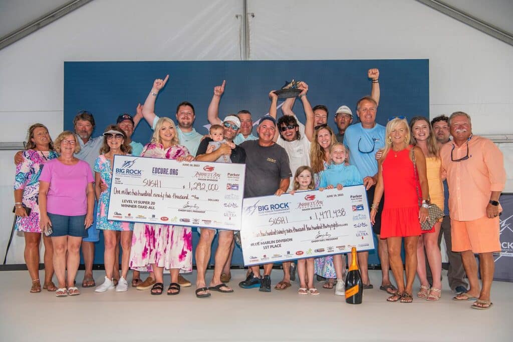A sport-fishing team stands at the awards ceremony of the Big Rock Blue Marlin Tournament.