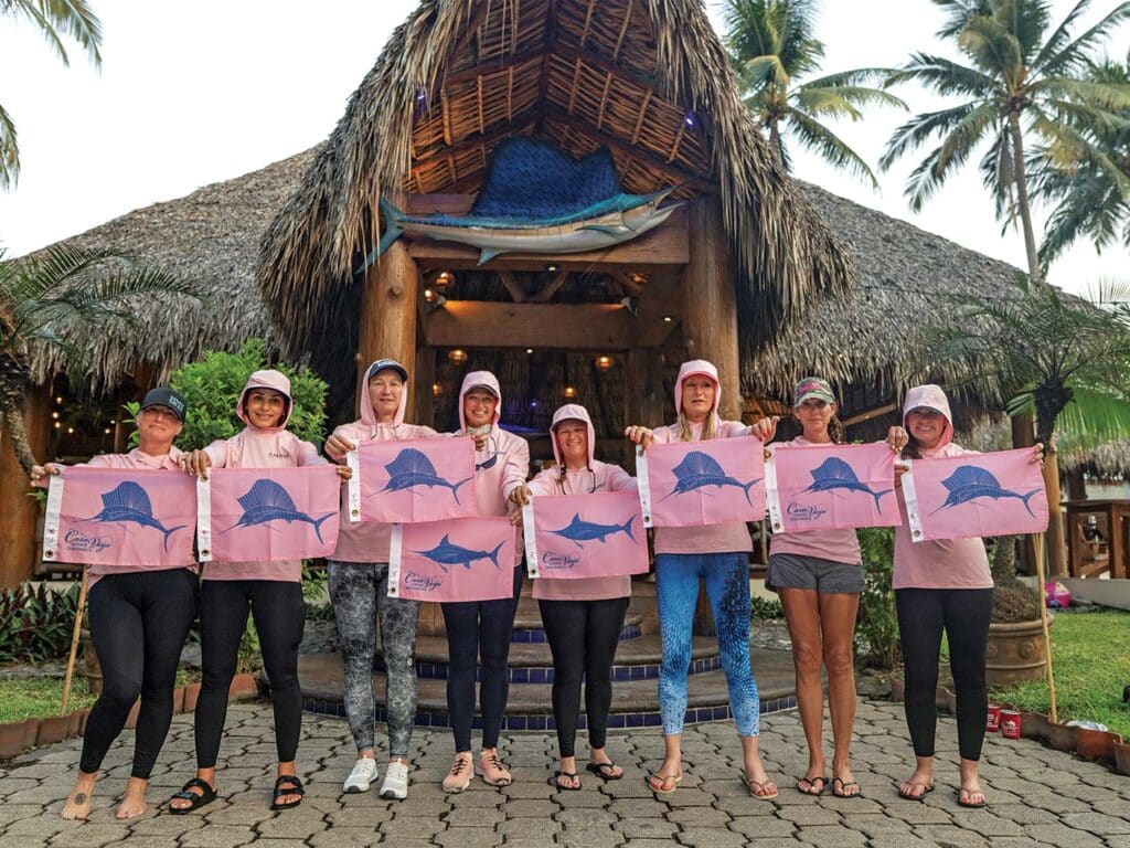 A lineup of Marlin Expedition's Ladies-Only team outside of a fishing lodge.