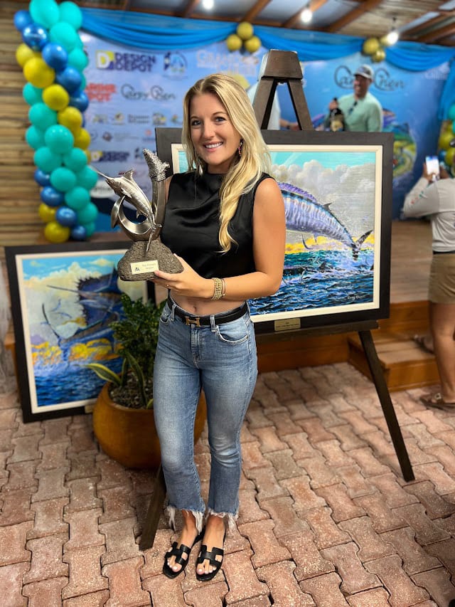 Maddy Hazlett accepting Top Lady Angler award.