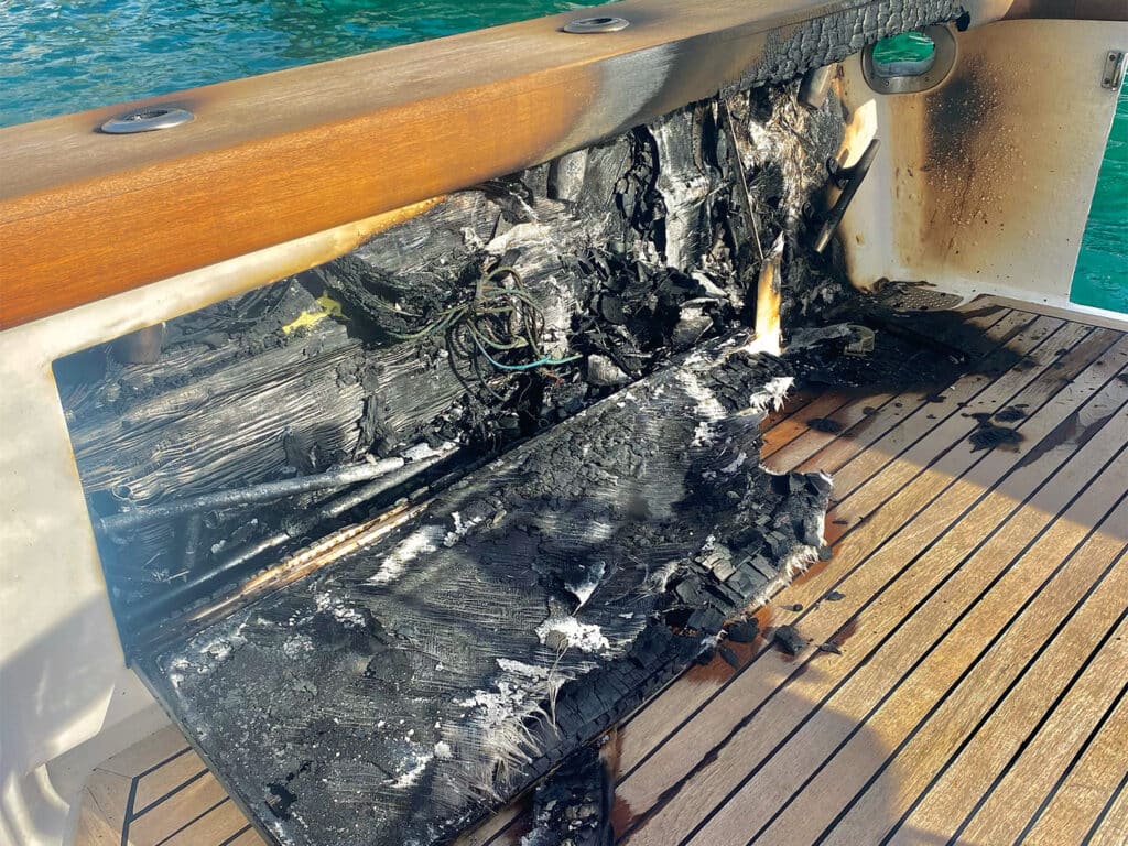 The burned out cockpit of a sport-fishing boat after a fire.