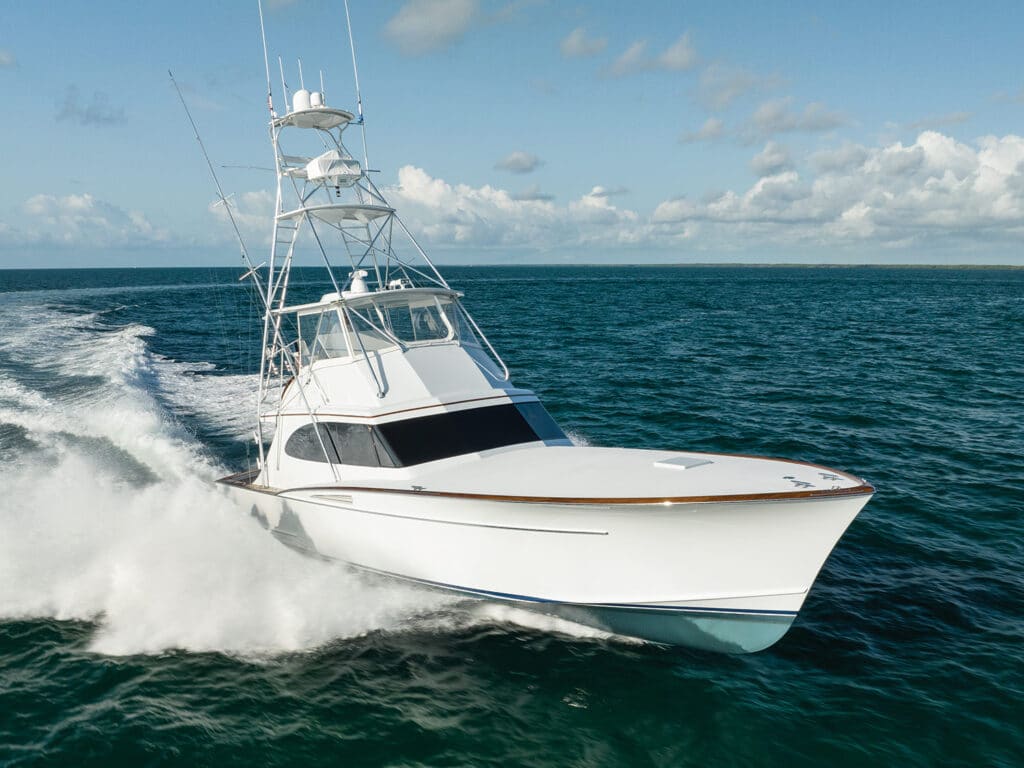 A sport-fishing boat cruises across the water.