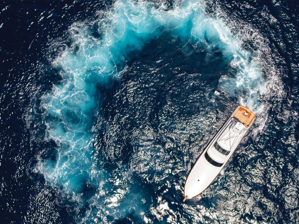A top-down view of a sport-fishing boat testing turning circles.
