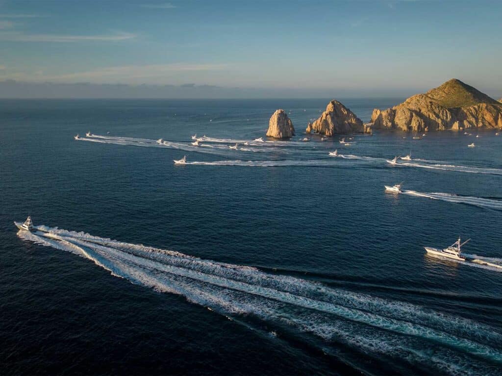 Aerial view of a fleet of sport-fishing boats leaving out for a day on the water.