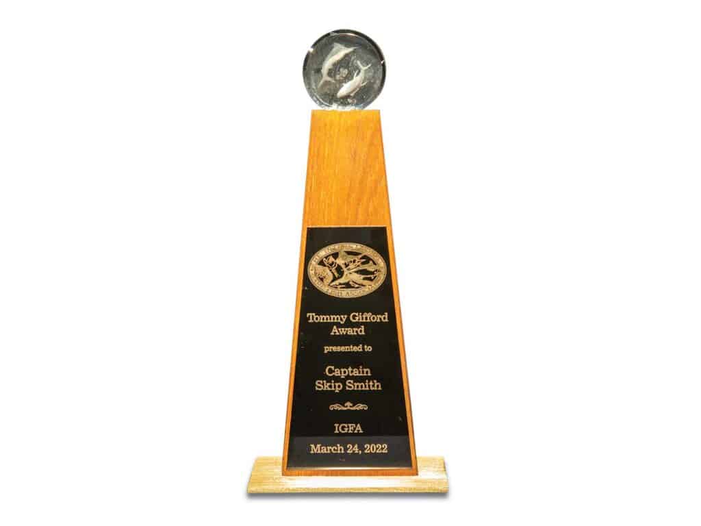 The IGFA Tommy Gifford Award trophy isolated on a white background.