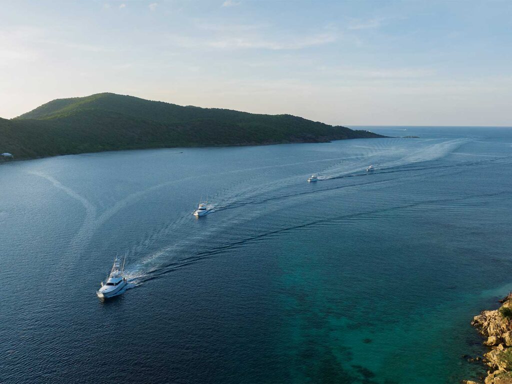 A fleet of sport-fishing boats cruising through the open waters.