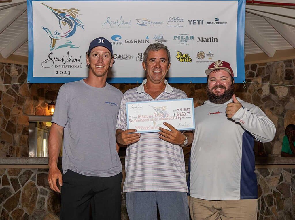A trio of sport-fishers standing at the awards ceremony of the Scrub Island Invitational.