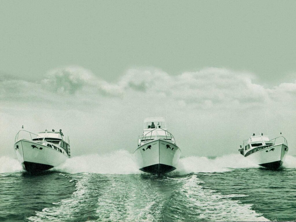 Three Viking Yachts cruising across the open water.