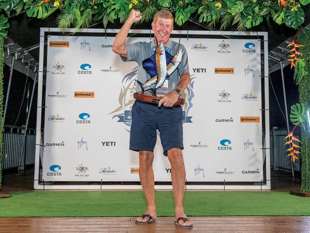 David Fingland holding up awards at the 2023 Offshore World Championship.