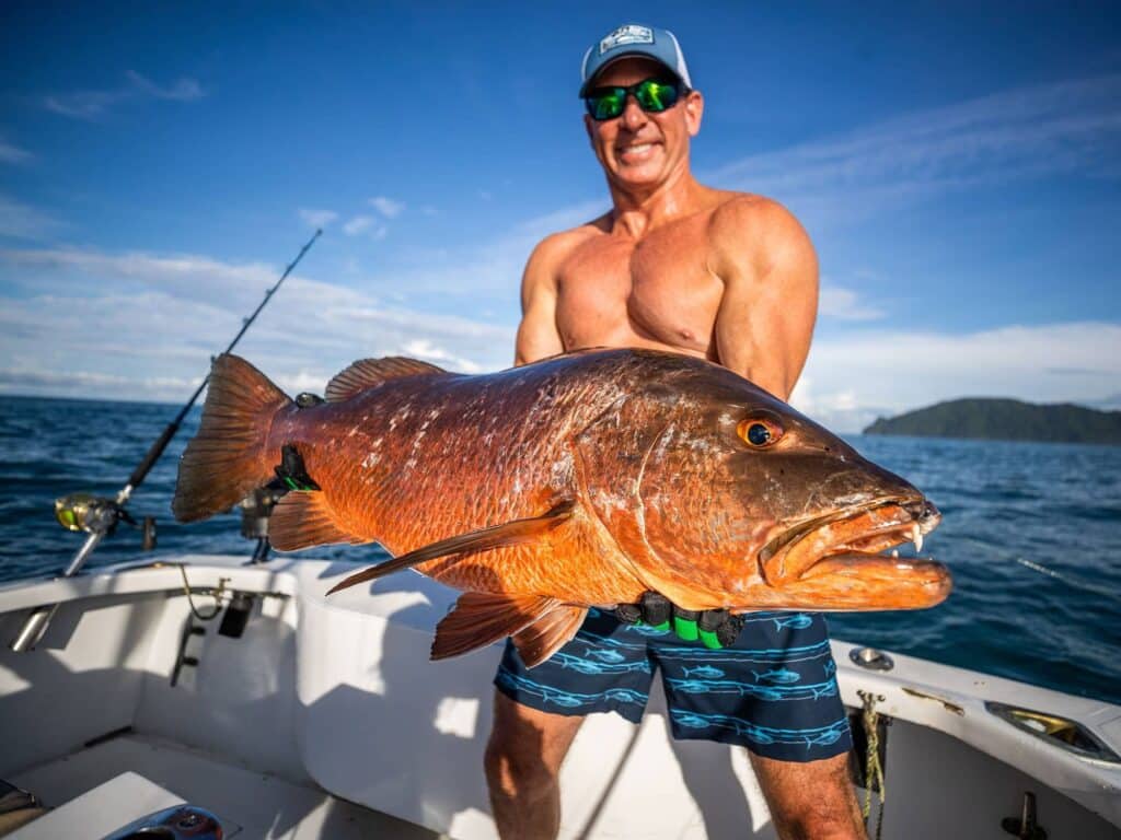 An angler showing off inshore-fishing haul