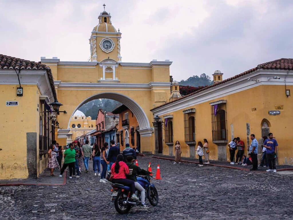 View of Antigua as people and tourists wander through the streets.