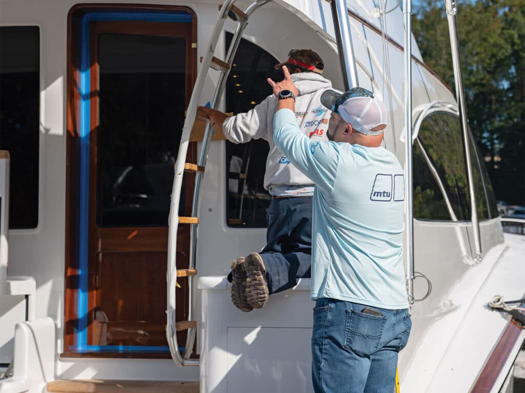 John Floyd directs builders around a sport-fishing boat build.