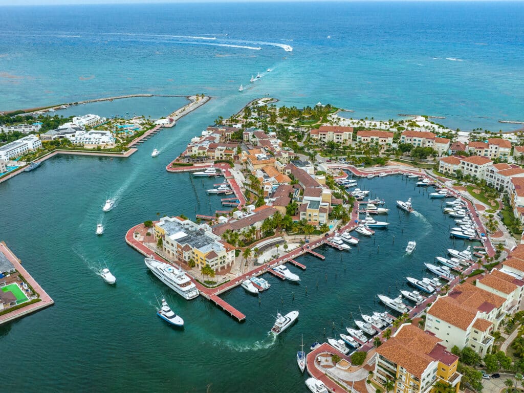 A fleet of sport-fishing boats cruise into Marina Cap Cana's docks.