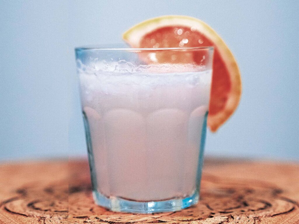 A frozen paloma garnished with grapefruit slice.