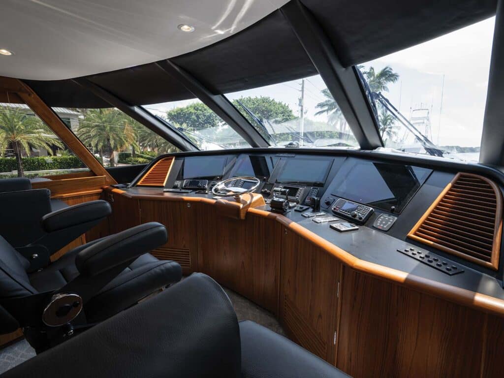 Several displays built into the helm of the Merritt 88. Wood panels surrounds the instrument boards.
