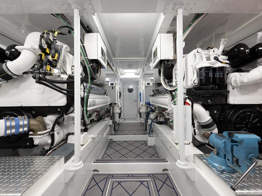 The clean, crisp white engine room of the Merritt 88.