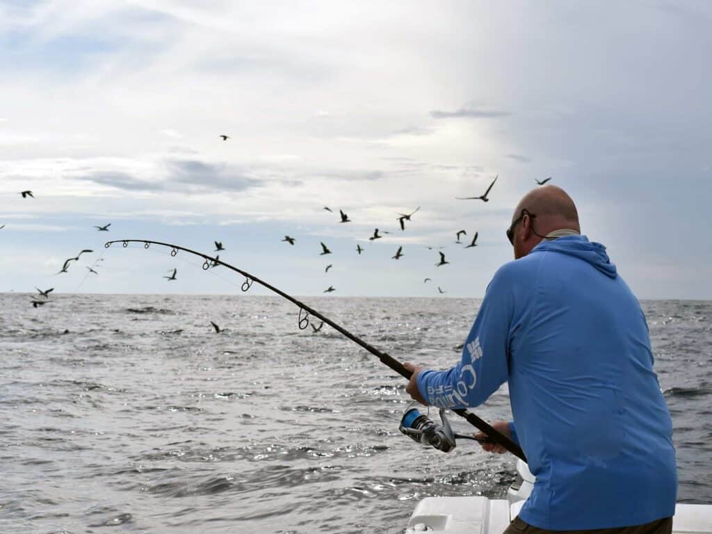 Angler fishing in the ocean.