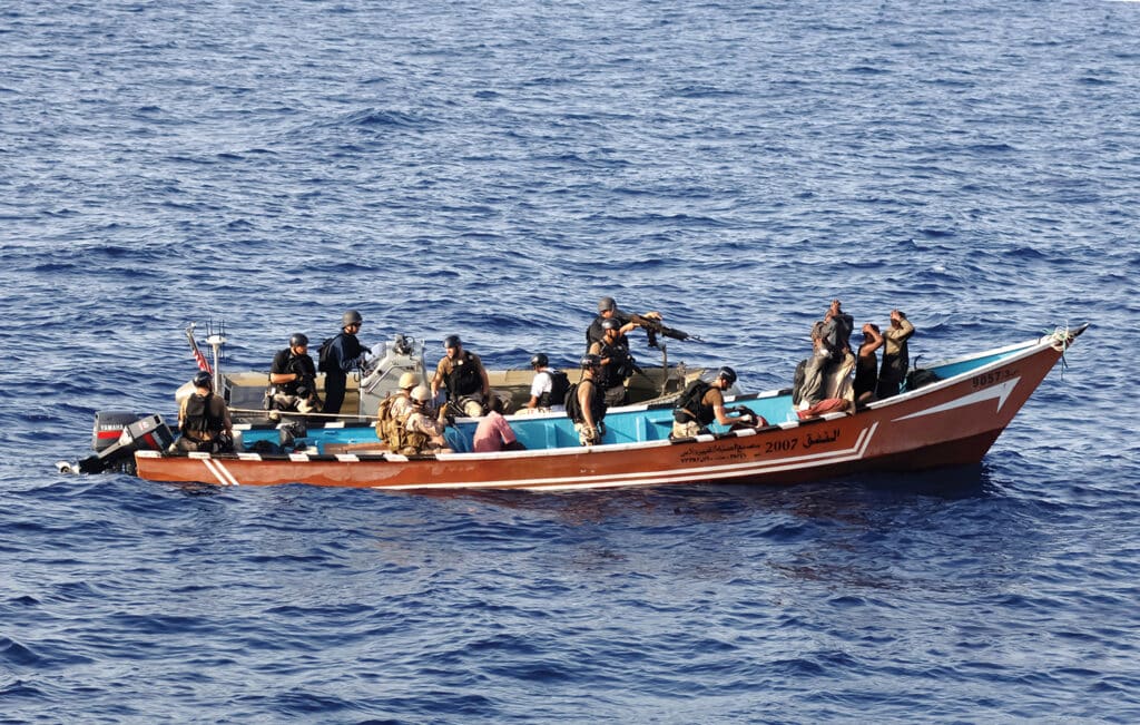 The U.S. Coast Guard pulled up next to a skiff.