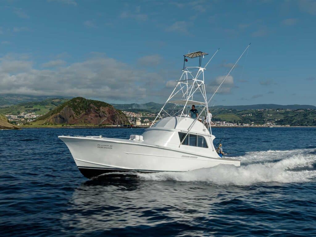 The Double Header sport-fishing boat cruising across the waters.