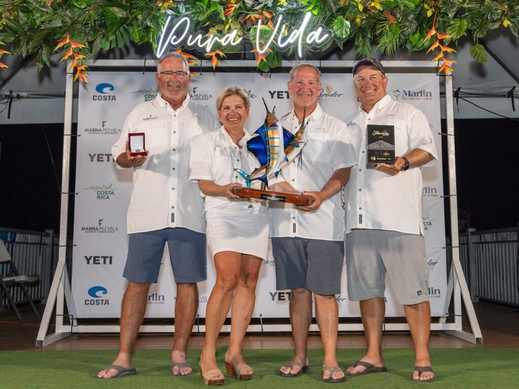 The third place team of the 2024 Costa Offshore World Championship celebrating at the awards ceremony.