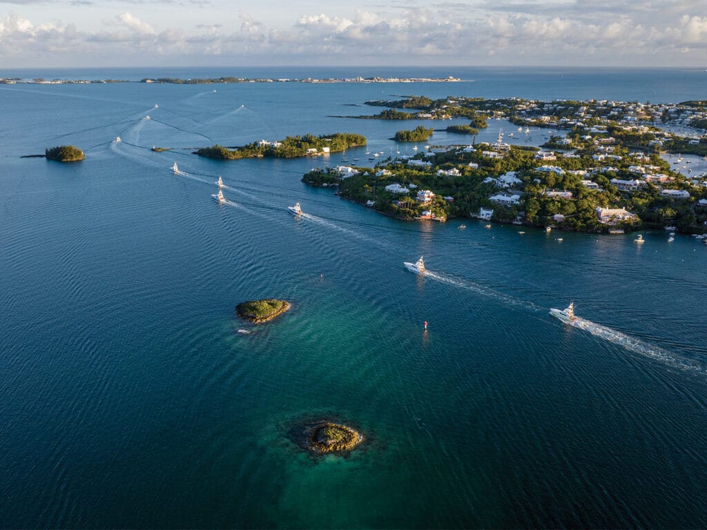 Aerial view of sport-fishing boats cruising out for a day of fishing.