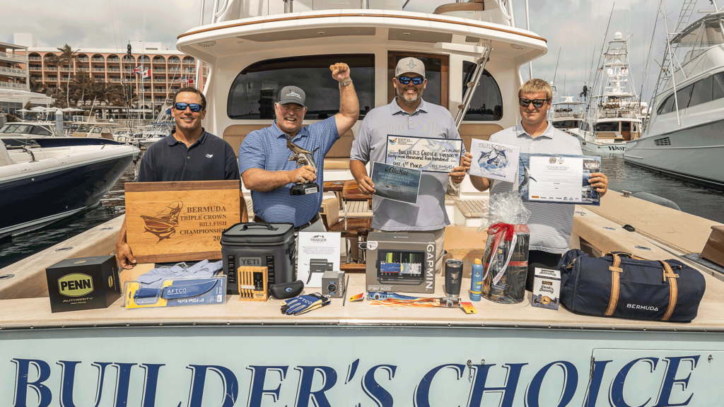 A sport-fishing team aboard "Builder's Choice" celebrates a win at the 2023 Bermuda Triple Crown surrounded by their prizes and winnings.