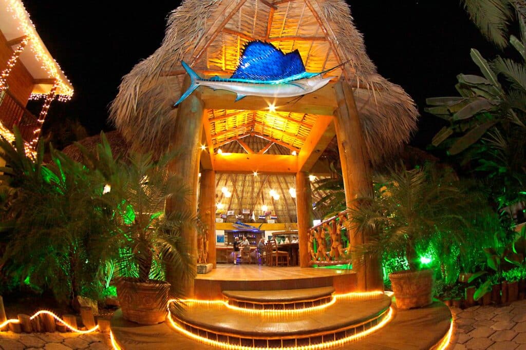 Outdoor entryway of Casa Vieja Lodge lit up at night.