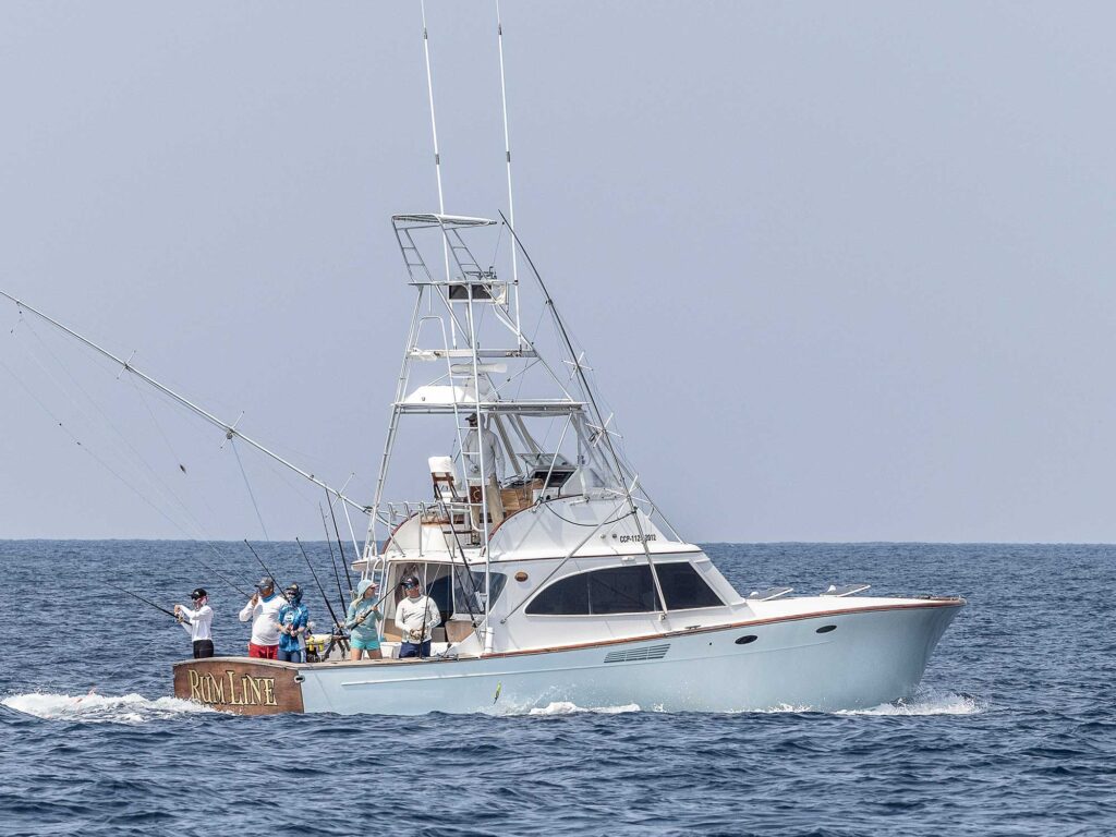 A sport-fishing boat setting out for a day on the water.