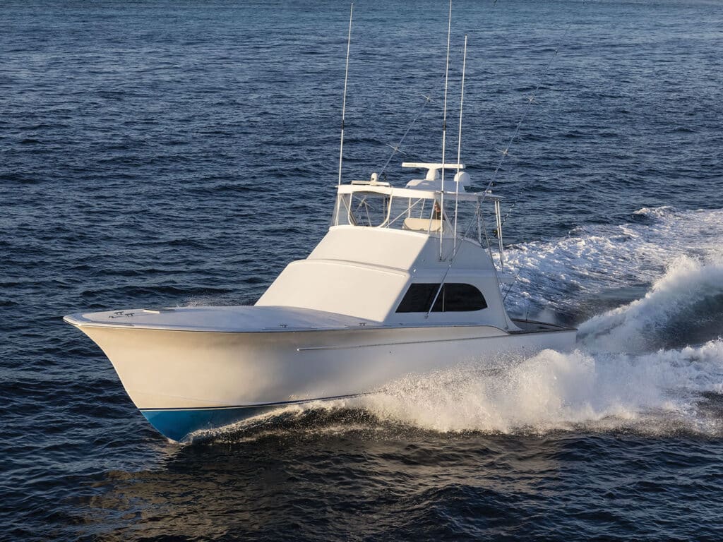 A sport-fishing boat cruising across the ocean.