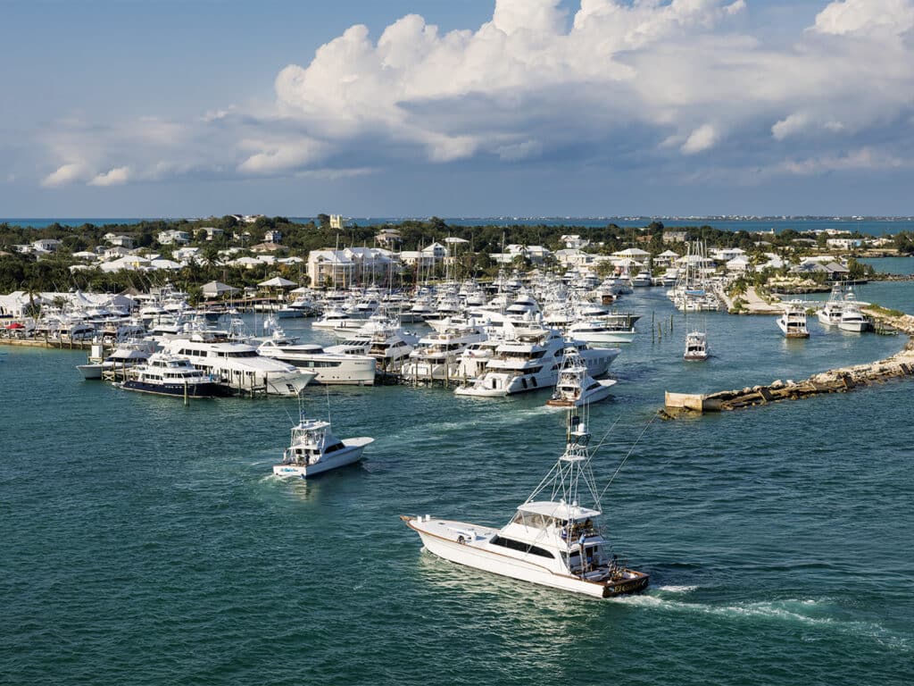 A fleet of sport-fishing boats docked at a marina during tournament relief efforts.