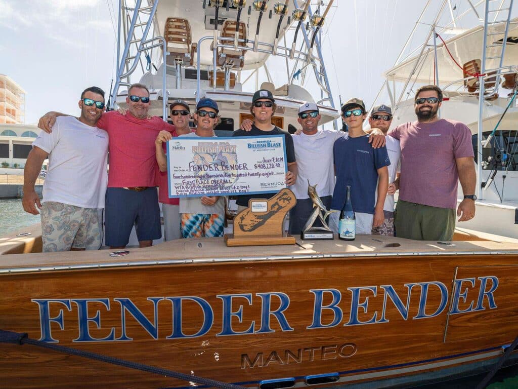 a group of men holding signs and holding up their trophies