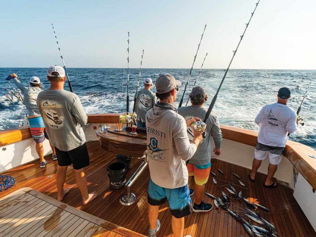 Anglers in the cockpit of a sport-fishing boat.