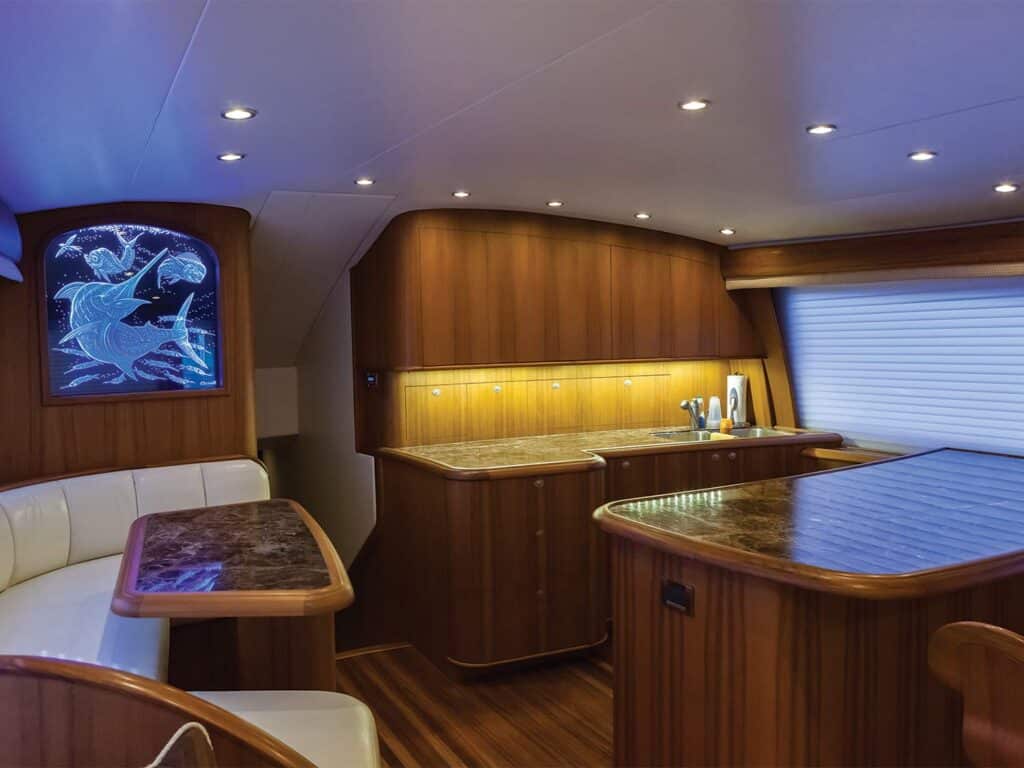 The interior salon of a sport-fishing boat showing off all its lighting options.