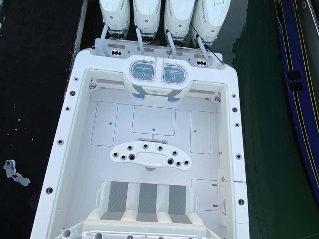 Top-down view of the Invincible 43 Open. Four outboard motors are attached to the boat.