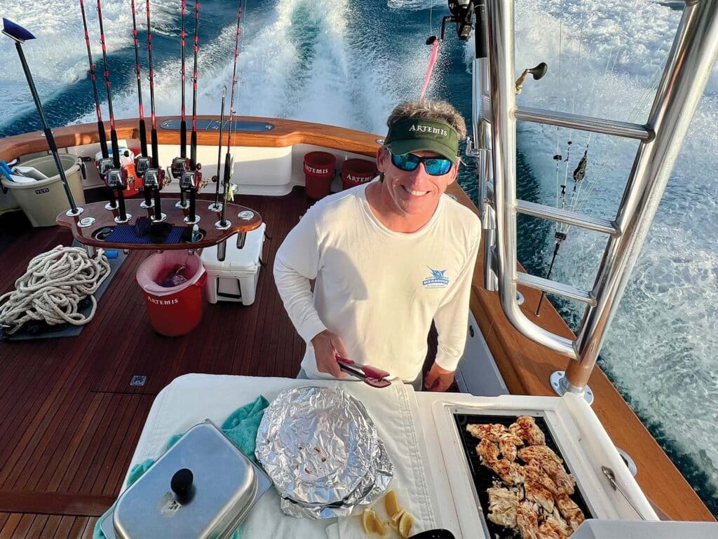 John Darby preps and cooks meals aboard a sport-fishing boat.