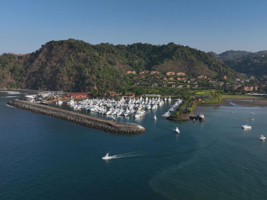 Aerial view of Los Suenos Resort and Marina. The docks are filled with sport-fishing boats.