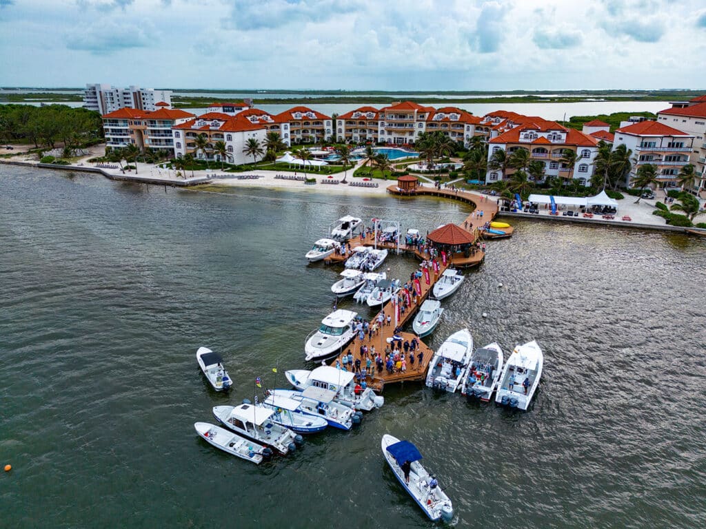 Aerial view of a sport-fishing marina at the Grand Caribe Deep Sea Classic. Many sport-fishing boats are seen docked in slips.