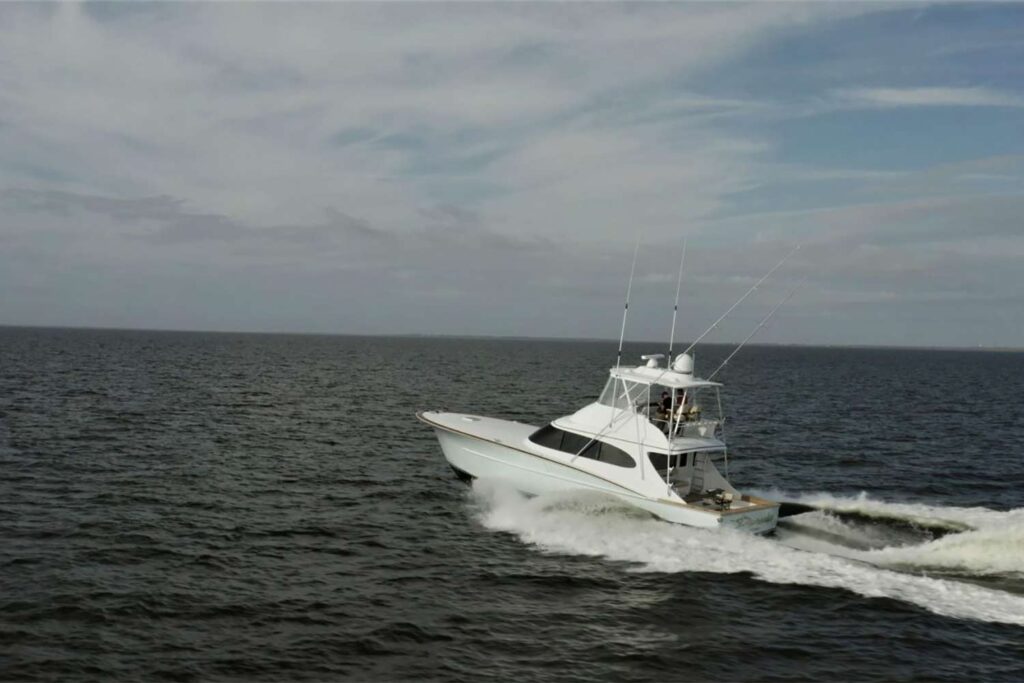 The Pursuit sport-fishing boat cruising across the ocean.
