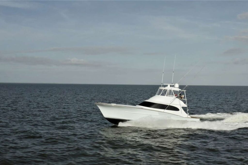 The Pursuit sport-fishing boat cruising across the ocean.