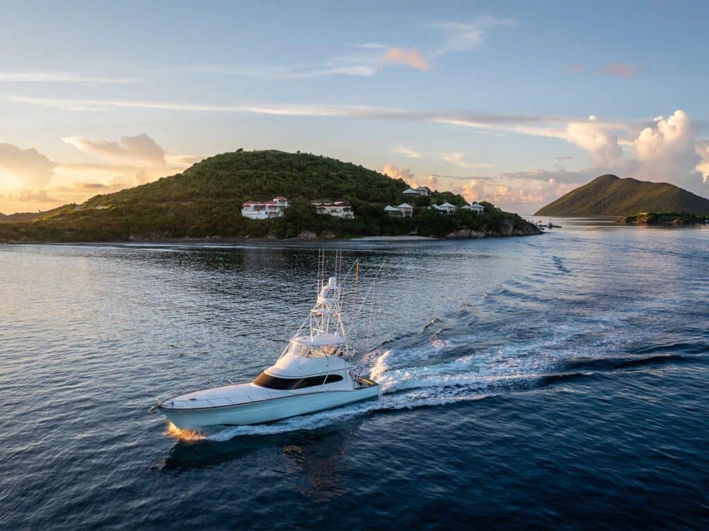 A sport-fishing boat cruises across the waters of Scrub Island.