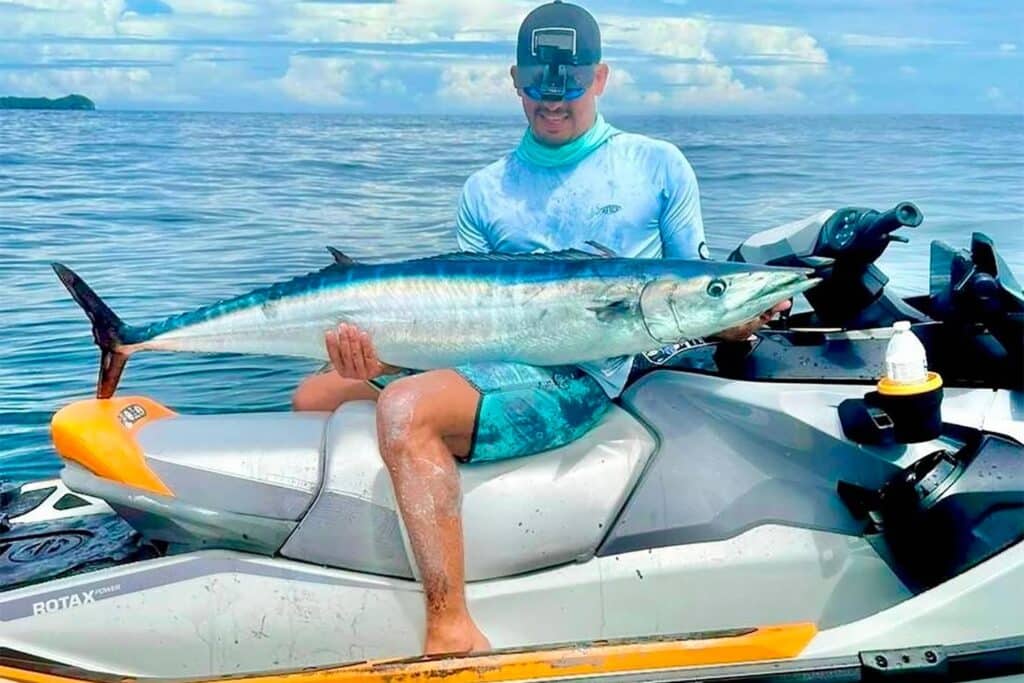 Angler holding up a fish.