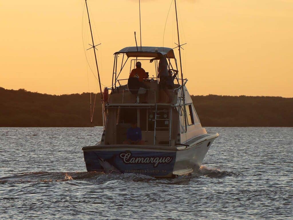 A sport-fishing boat cruising on the water.