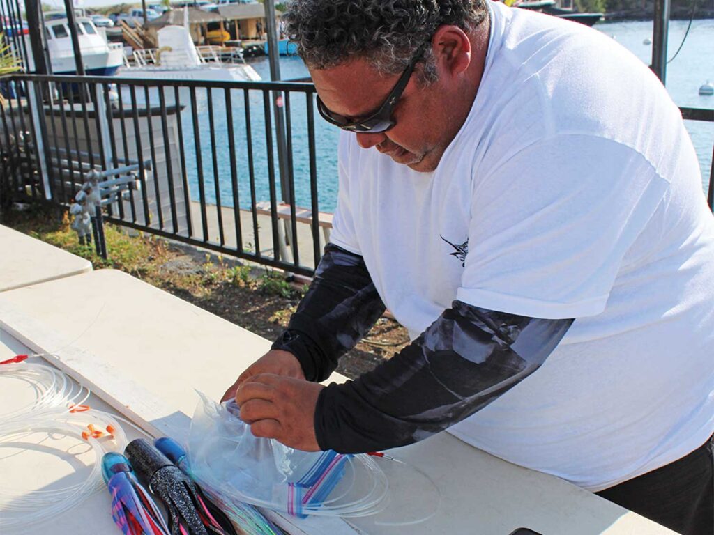 A tournament staff member checks each leader against IGFA regulation measures.