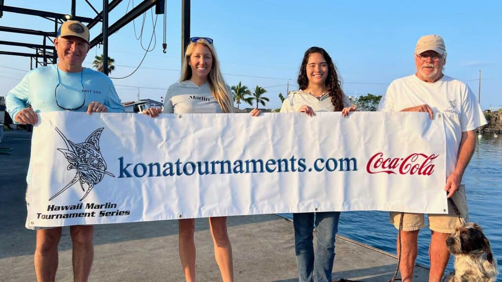 The Hawaii Marlin Tournament Series team holding up the konatournaments.com banner