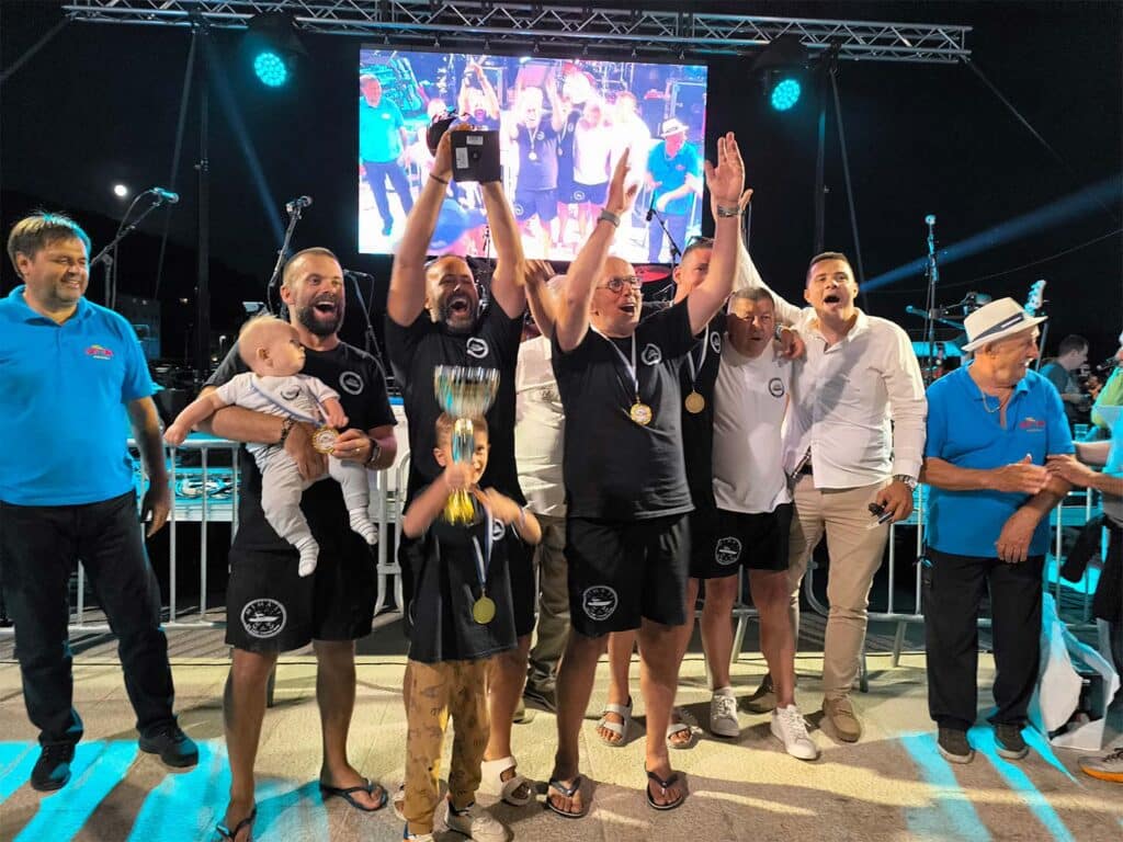 Sport-fishing team celebrating.