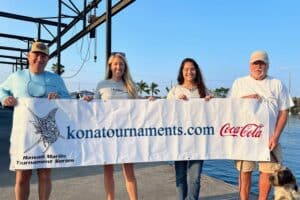 The Hawaii Marlin Tournament Series team holding up the konatournaments.com banner