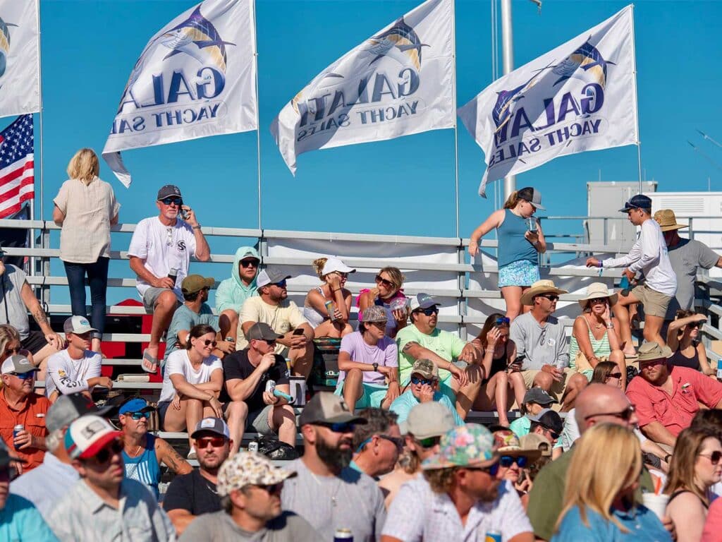 The crowd seated at the 2025 MGCBC surrounded by Galati Yacht Sales flags