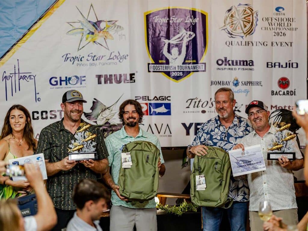 Sport-fishing team celebrating.