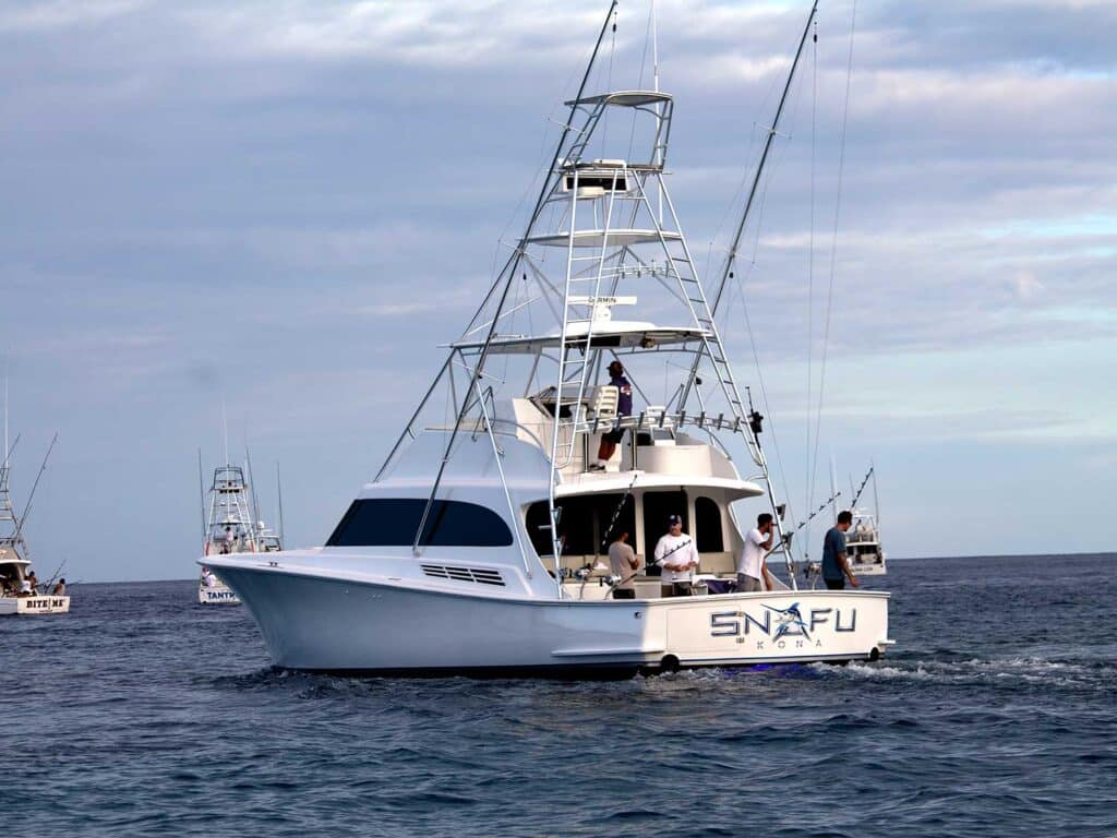 The sport-fishing boat Snafu cruises across the water.