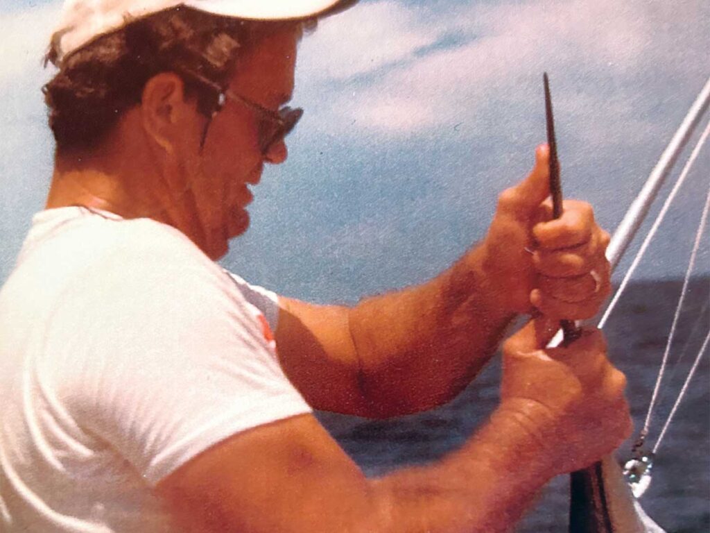 Bill McLellan holding a sportfish bill.